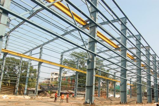 Corrugated steel structures for industry in India featuring advanced insulation panels.